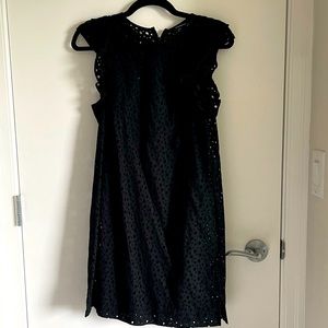 Club Monaco eyelet dress with ruffled sleeves and comes with black liner